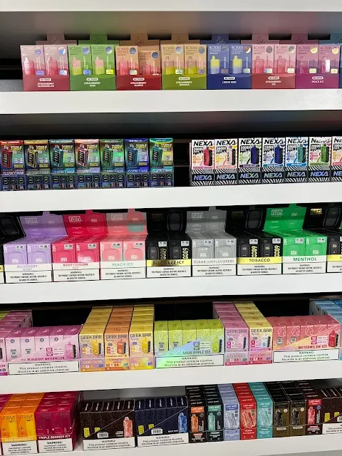 Product shelf showing vapes and disposables